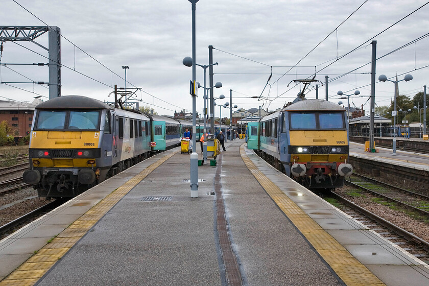 90008, 11.30 Norwich-London Liverpool Street & 90009, LE 11.00 Norwich-London Liverpool Street, Norwich station 
 A familiar scene at the city end of Norwich station sees a pair of Greater Anglia services that will leave for London within half an hour of each other. To the left 90008 'The East Anglian' will leave later with the 11.30 to Liverpool Street whilst to the right 90009 'Diamond Jubilee' will leave first at 11.00 
 Keywords: Diamond Jubilee The East Anglian 90008 11.30 Norwich-London Liverpool Street 90009 11.00 Norwich-London Liverpool Street Norwich station