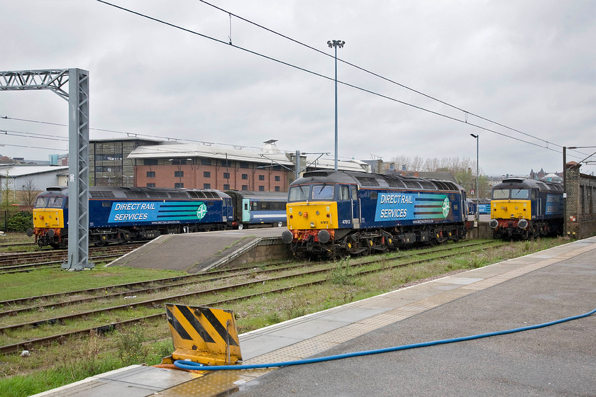 47818, 47813, 47841 & 47501, stabled, Norwich yard 
 All four of the hired-in DRS Class 47 are seen in this view at Norwich for work on the Greater Anglia network. To the left is 47818 with 47813 'Solent' centre. To the right is 47841 in the background with 47501 partially hidden by the wall. Despite the collection of vintage diesels, I was a little disappointed that there was no Class 37 as I have seen before. 
 Keywords: 47818 47813 Solent 47841 47501 Craftsman stabled Norwich yard