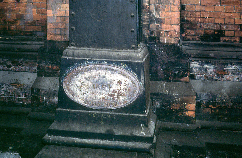 Butterley Company plate, London St. Pancras station 
 One of a number of company build plates found around St. Pancras station attached to the base of one of the substantial supporting columns. The Butterley Company was a highly successful business based in Ripley, Derbyshire that was formed in 1790. It was involved in the manufacture of heavy engineering and large structures much of which revolved around the railways. One of their most famous structures was St. Pancras with them manufacturing the huge two hundred and forty foot wrought iron spans of the Barlow train shed. After surviving into recent years manufacturing things such as the Falkirk Wheel and Portsmouth's Spinnaker Tower the company was wound up in 2009 with various parts of it sold off so ending a fine heritage of heavy manufacturing and one that has gone the way of so many others. 
 Keywords: Butterley Company plate London St. Pancras station