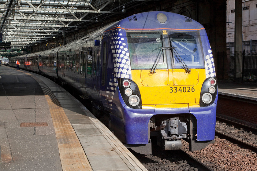 334026 & 334017, SR 16.49 Edinburgh Waverley-Helensburgh Central (2H59), Edinburgh Waverley station 
 A two-set late afternoon service formed by 334026 and 334017 is seen leaving Edinburgh Waverley with the 16.49 to Helensburgh Central. A fascinating journey that crosses Scotland from east to west passing through its two main cities. 
 Keywords: 334026 334017 16.49 Edinburgh Waverley-Helensburgh Central 2H59 Edinburgh Waverley station