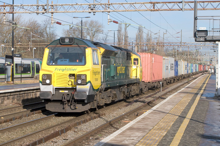 70008, 05.01 Trafford Park-Felixstowe North FLT (4L97), Northampton station 
 70008 takes the centre road through Northampton leading the 05.01 Trafford Park to Felixstowe Freightliner. I'm sure that we all agree that these class 70s will win no prizes in the external design awards! However, the sound that they make is impressive and, living as I do a short distance from the WCML, my attention is always drawn when one is passing. 
 Keywords: 70008 05.01 Trafford Park-Felixstowe North FLT 4L97 Northampton station