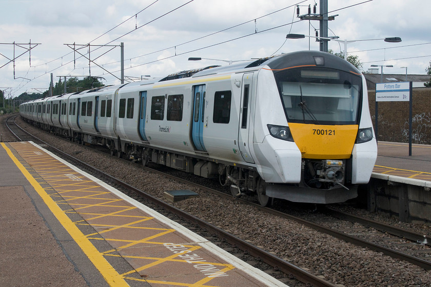 700121, TL 12.24 Cambridge-Brighton (9S31, RT), Potters Bar station 
 700121 passes through Potters Bar station working the 12.24 Cambridge to Brighton Thameslink service. I was surprised at the number of services I observed formed by these units, their takeover seemed complete. 
 Keywords: 700121 12.24 Cambridge-Brighton 9S31 Potters Bar station