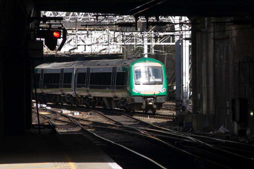 170515, LM 09.05 Birmingham New Street-Shrewsbury (1J08), Birmingham New Street station 
 The principle of the photograph was good but the execution is very poor! Birmingham New Street offers plenty of opportunities to frame trains in tunnels but it only really works well when the sun is illuminating them. However, on this occasion, the camera struggled with the extreme contrast thus there is no detail in the overexposed section of the cab where the sun is directly reflecting. 170515 leaves New Street working the 09.05 to Shrewsbury. 
 Keywords: 170515 09.05 Birmingham New Street-Shrewsbury 1J08 Birmingham New Street station London Midland Turbostar