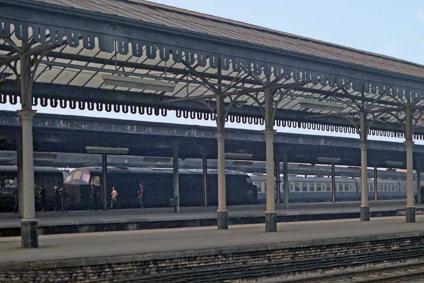 Class 45, unidentified up working, York station 
 An unidentified Peak runs into York station with an unidentified down working. I always found York station strangely alluring. I think because of its sharply curved platforms and restricted views from one end to another meaning that you never knew what was coming in and from where. Even more so when the drone of some twin Napiers could be heard reverberating around the trainshed!