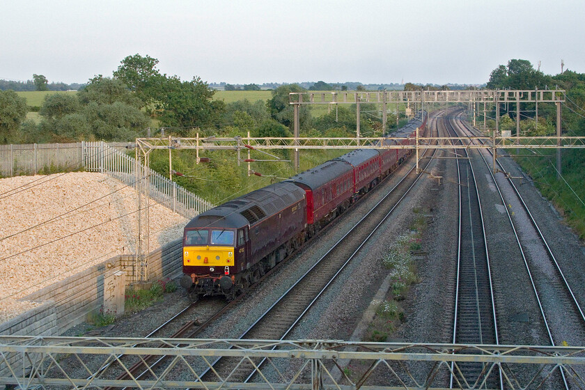 47812, return leg of The Cheshireman, 15.40 Chester-London Euston (1Z41, 5L), Ashton Road bridge 
 After securing a photograph of 60103 'Flying Scotsman' hauling the returning Cheshireman charter a jump off my steps and a dash across the road to climb them again allowed this going away photograph of WCR's 47812 pushing at the rear. Obviously, looking in this direction with the sun behind me the lighting is more normal than in the one taken of 'Scotsman'. I like taking photographs from this bridge between the villages of Roade and Ashton but a ladder is a requisite and be prepared to put up with some strange glances from normals passing uncomfortably close in their cars! 
 Keywords: 47812 The Cheshireman 15.40 Chester-London Euston 1Z41 Ashton Road bridge WCR West Coast Railway 4472 60103 Flying Scotsman