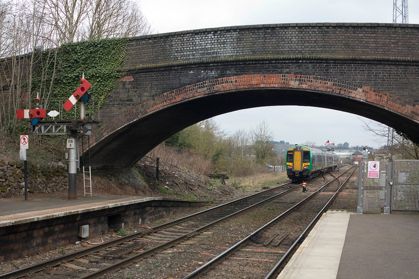 172335, LM 13.17 Worcester Shrub Hill-Dorridge (2C42, RT), Droitwich station 
 175335 leads Droitwich Spa station and is about to take the 'Dark Side' line up through Kidderminster and Stourbridge working the 13.17 Worcester Shrub Hill to Dorridge. To the left is Droitwich's superb splitting centre-pivot down starter signal. The arm to the left guards the down goods loop. 
 Keywords: 172335 2C42 Droitwich station