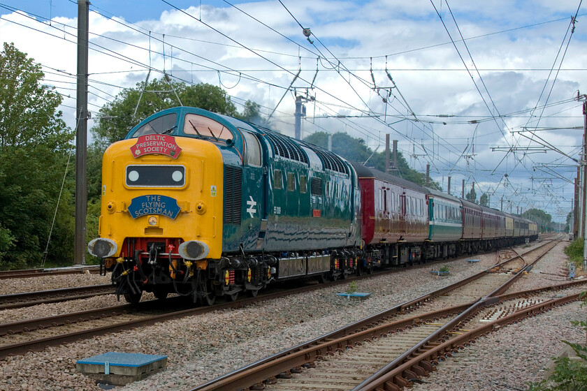 55009, outward leg of The capital Deltic Reprise, 06.57 Willington-London King's Cross (1Z24, 34L), Tallington 
 This is what Deltics were designed and built to do, namely running at up to one hundred miles per hour on the ECML between Scotland and London, something that they did for twenty years. Having recently been completely refurbished by the Deltic Preservation Society at its Barrow Hill base 55009 'Alycidon' passes Tallington at line speed working The Capital Deltic Reprise charter. At this point the train was running some thirty minutes late having made up the same in deficit being delayed by an hour leaving Burton Ot Wetmore sidings where the service originated. Evidently, the delay was caused by paperwork relating to the stock not being in order necessitating some shunting of the coaches before a departure was authorised. 
 Keywords: 55009 The capital Deltic Reprise 06.57 Willington-London King's Cross 1Z24 Tallington Alycidon