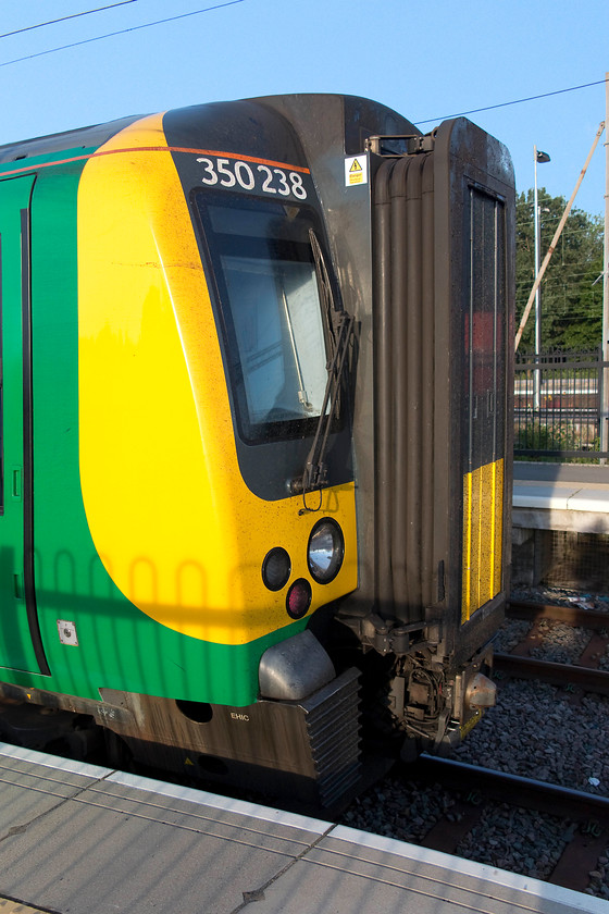 350238, LM 06.35 Northampton-Crewe (2U21, 2L), Northampton station 
 A study of practicality rather than beauty! These Desiros have been a totally successful design but one that will win no prizes for their aesthetic appeal. In its London Midland livery, 350238 sits in one of the bay platforms to leave with the 06.35 to Crewe. My boss and I took this train as far as Stafford travelling via the Trent Valley. 
 Keywords: 350238, LM 06.35 Northampton-Crewe (2U21, 2L), Northampton station