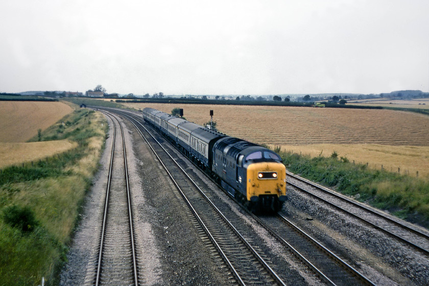 55008, 18.11 York-London King`s Cross (1A31), Swayfield SK994231 
 With the harvest underway in the field behind the train, 55008 'The Green Howards' takes the 18.11 York to King's Cross southwards. The evening scene is on the southern side of Stoke Bank at Swayfield, a location that I have visited a number of times. I do not know what shutter speed I was using, but it was pretty slow, judging by the motion blur, but it's a Deltic after all! 
 Keywords: 55008 18.11 York-London King`s Cross 1A31 Swayfield SK994231