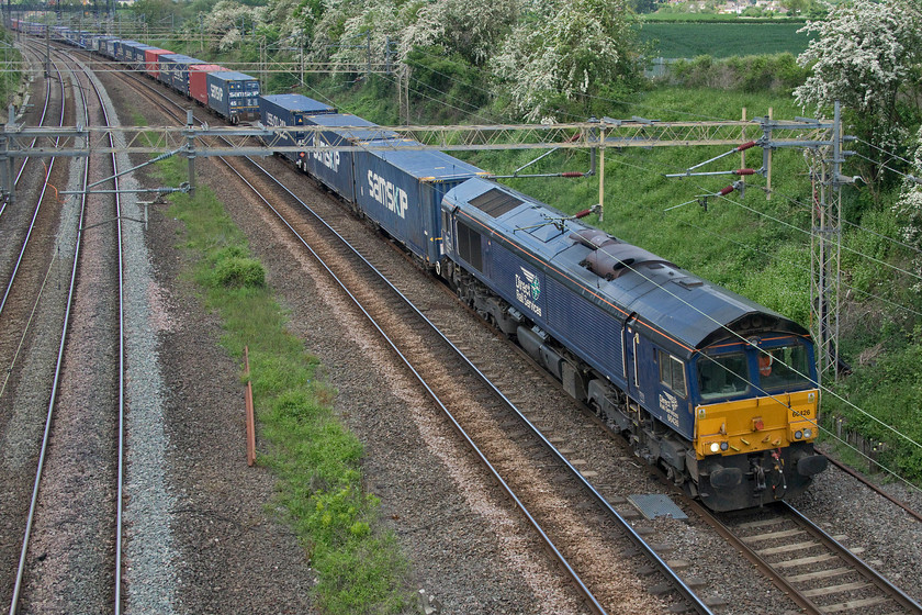 66426, 13.51 DIRFT-Purfleet (4L48, 10E), Victoria bridge 
 DRS' 66426 leads the 4L48 Daventry to Purfleet 'Tesco' as it is colloquially referred to past Victoria bridge in south Northamptonshire. The last time that I photographed this locomotive it was in a slightly different state, see...... https://www.ontheupfast.com/p/21936chg/27161231804/x66426-68006-display-drs-open-day 
 Keywords: 66426 13.51 DIRFT-Purfleet 4L48 Victoria bridge