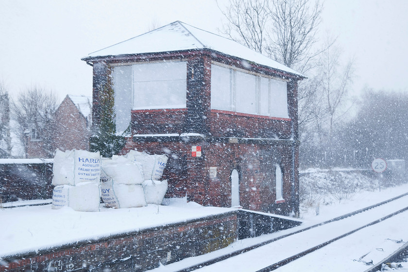 Castleford Station signal box, closed (NE, 1882) 
 When the hideous new Castleford signal box was opened at the site of the A655 level crossing by Railtrack in 1997, several boxes in the area were closed. Castleford Station signal box, seen here in a blizzard, was one of them. Like the Gates signal box it was a North Eastern Railway structure dating from 1882 and is subject to a preservation order. There have been moves to restore it and put it to a new use but nothing has come to fruition. The main problem appears to be that it's on the old up platform that is out of use and no longer connected to the rest of the station since the footbridge was removed. 
 Keywords: Castleford Station signal box NE 1882