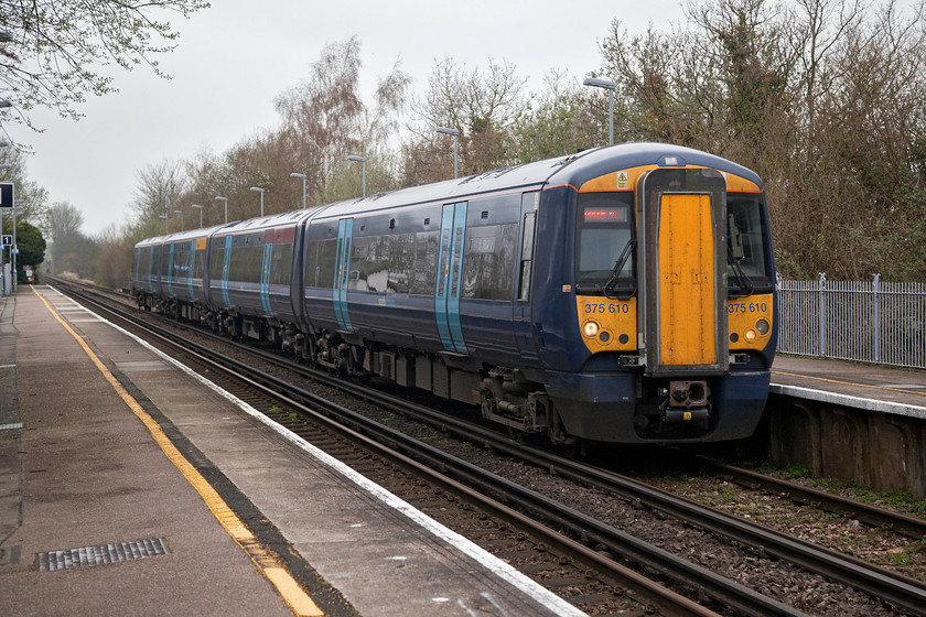 375610, SE 11.34 London Victoria-Dover Priory (2K18, 1E), Selling station 
 Selling is a delightfully rural location in the middle of the Kent countryside surrounded by hop fields and other market gardening operations. Here, 375610 passes straight through Selling station with the 11.34 Victoria to Dover train. I like the Southeastern livery and think that it suits these Electrostar 375s well. 
 Keywords: 365610 2K18 Selling station