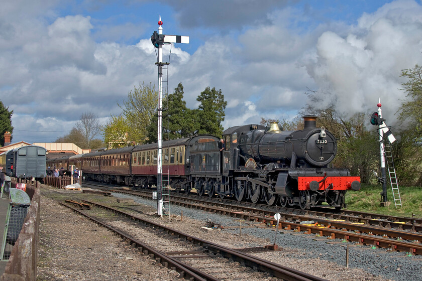 7820, 12.35 Broadway-Cheltenham Racecourse, Toddington station 
 Unfortunately, taken the wrong side for the sun meaning that the image has needed a little Photoshop treatment shows 7820 'Dinmore Manor' leaving Toddington station leading the 12.35 Broadway to Cheltenham Racecourse service. However, at least the wind is taking the exhaust away in the right direction! Despite it being a Thursday in early April, the station and the train was busy with people enjoying a day out. 
 Keywords: 7820, 12.35 Broadway-Cheltenham Racecourse, Toddington station Dinmore Manor