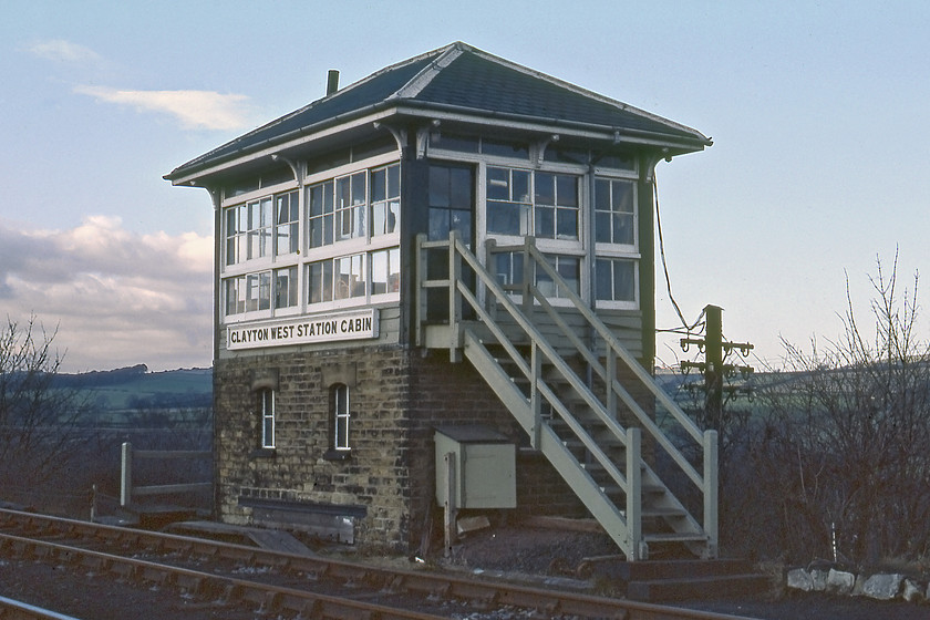 Clayton West Station Cabin signal box (L&Y, 1878) 
 The delightful Lancashire and Yorkshire Clayton West Station Signal box is seen in the dying afternoon light. The box is largely original complete with its wooden nameboard that survived the LMS renewal programme. It was constructed in 1878 and survived until the closure of the branch in January 1983. 
 Keywords: Clayton West Station Cabin signal box Lancashire and Yorkshire Railway