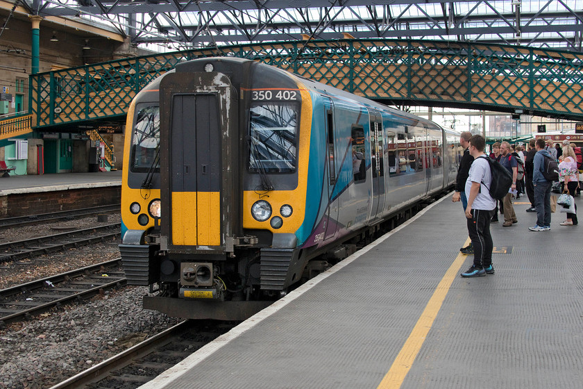 350402, TP 16.11 Glasgow Central-Manchester Airport (1M91, RT), Carlisle station 
 TransPennine Express' 350402 arrives at Carlisle forming the 16.11 Glasgow Central to Manchester Airport. We took this service to Manchester Picadilly. The train was well loaded with all seats taken and some standing. Once again, is a four-car DMU the most appropriate type of train for an inter-city service such as this? At least TPE appears to be thinking about this and listening to customers as they are about to re-introduce 'proper' trains composed of their new Mk. IV CAF coaches complete with a locomotive operating in push-pull mode. 
 Keywords: 350402 16.11 Glasgow Central-Manchester Airport 1M91 Carlisle station