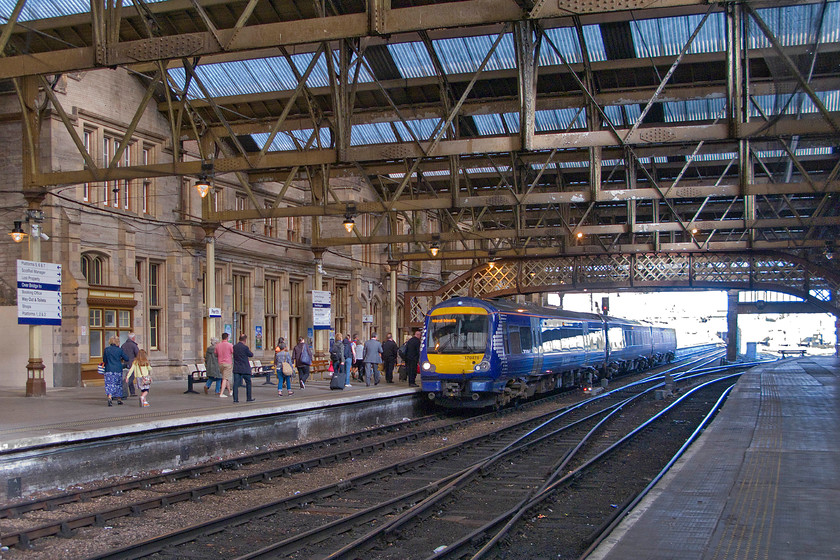 170478, SR 06.50 Inverness-Edinburgh Waverley (1B08), Perth station 
 When Perth station was opened in 1848 the structure, designed by Sir William Tite won an architecture prize and seeing the sun stream through the glazed roof here it is clear to see why. Passengers board 170478 as it prepares to leave with the 06.50 Inverness to Edinburgh Waverley. Without wishing to open up a massive debate and to incur the wrath of quizzers, I will simply state that the platform is use here is considered to be one of the longest on the UK network up there with Gloucester, Colchester and Bournemouth. 
 Keywords: 170478 06.50 Inverness-Edinburgh Waverley 1B08 Perth station ScotRail