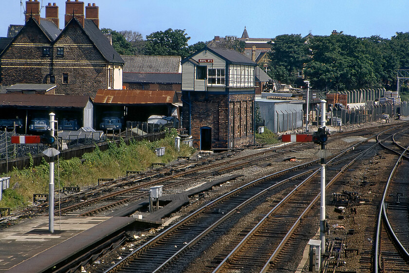 Rhyl No. 1 signal box (LNW, 1900) 
 Photographs of Rhyl Number 1 signal box were always tricky to secure due to its location off the end of the station on the up side of the tracks. Utilising my 135mm telephoto lens the 1900-built Type 4 is seen from the station footbridge. In 1990 the box was renamed Rhyl following the closure of Number 2 box at the western end of the station. Unfortunately, I failed to capture in this photograph the superb eight-doll LMS gantry that is just out of view to the right. Notice the line of parked up (it is a Sunday after all) Leyland FG flatbed coal trucks in the adjacent coal merchants. 
 Keywords: Rhyl No. 1 signal box L&NWR