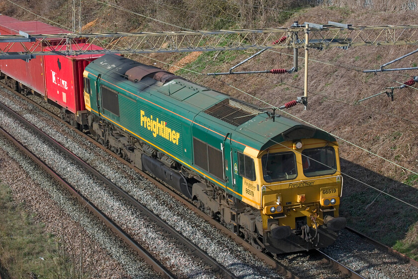 66519, 12.16 Lawley Street-London Gateway (4L56, 2E), Victoria bridge 
 A study of a Class 66 in action, well I'll couch it in those words to cover for my photographic ineptitude! 66519 leads the 12.16 Lawley Street to London Gateway Freightliner past Victoria bridge just south of Roade. Unbelievably, this is only my second photograph of this particular Class 66 hence its inclusion. 
 Keywords: 66519 12.16 Lawley Street-London Gateway 4L56 Victoria bridge Freightliner