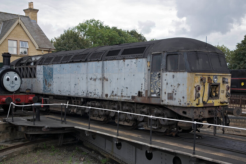 56128, awaiting restoration, Wansford Yard 
 Still displaying the remnants of its Transrail livery 56128 sits on the turntable in Wansford's yard. Unfortunately, this Class 56 was not operational and did not feature in the Nene Valley's diesel gala. I am not sure what the future holds for this Grid but judging by its state it could be heading for spares to keep other class members operational.

NB I was wrong with my comments above. After many more years of neglect and being moved from one storage location to another it was rebuilt to become GBRf liveried (complete with DMU-style speed whiskers) 69006 in 2023. (Note added 01.25) 
 Keywords: 56128 awaiting restoration Wansford Yard Grid