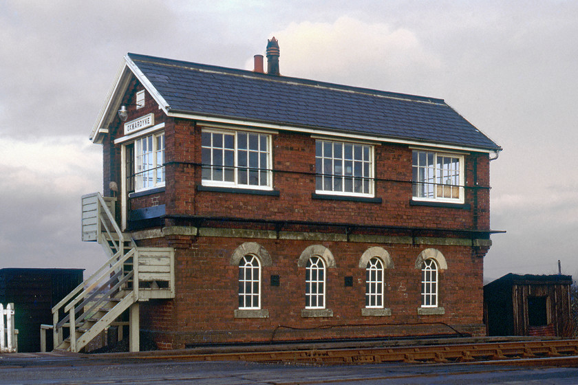 Oxmardyke Signal Box (NE, 1901) 
 Separated by only five years (1901 and 1903) Oxmardyke and Gilberdyke signal boxes (seen in the last image) are very different in their designs despite both being NER designed structures. Oxmardyke is a far more ornate and pleasing design with its segmented stone lintel windows to the locking room. From the front, its sense of symmetry is pleasing even with the stovepipe directly to the middle of the roofline. Notice the mop leaning by the side of the door at the top of the steps with the vinyl flooring inside probably shining and polished! 
 Keywords: Oxmardyke Signal Box NER North Eastern Railway