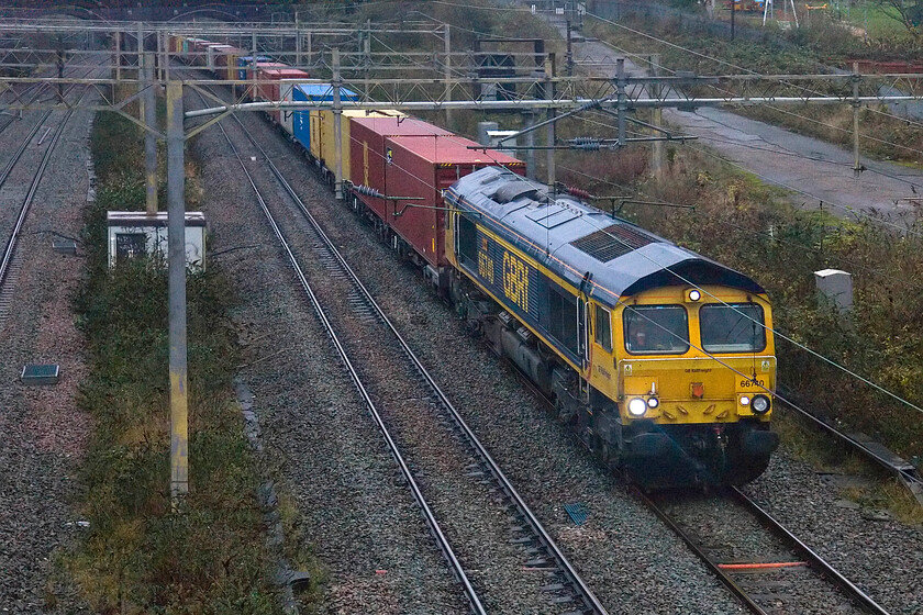 66740, 06.21 Hams Hall-London Gateway (4L12, 8L), site of Roade station 
 66740 'Sarah' emerges from Roade cutting now passing the site of the former station leading the 4L12 06.21 Hams Hall to London Gateway GBRf service. Like all the other photographs taken on this horrible morning this one has needed a fair bit of work to make it presentable but just fifteen minutes from when the first image was captured the light has improved noticeably but its all relative! 
 Keywords: 66740 06.21 Hams Hall-London Gateway 4L12 site of Roade station Sarah