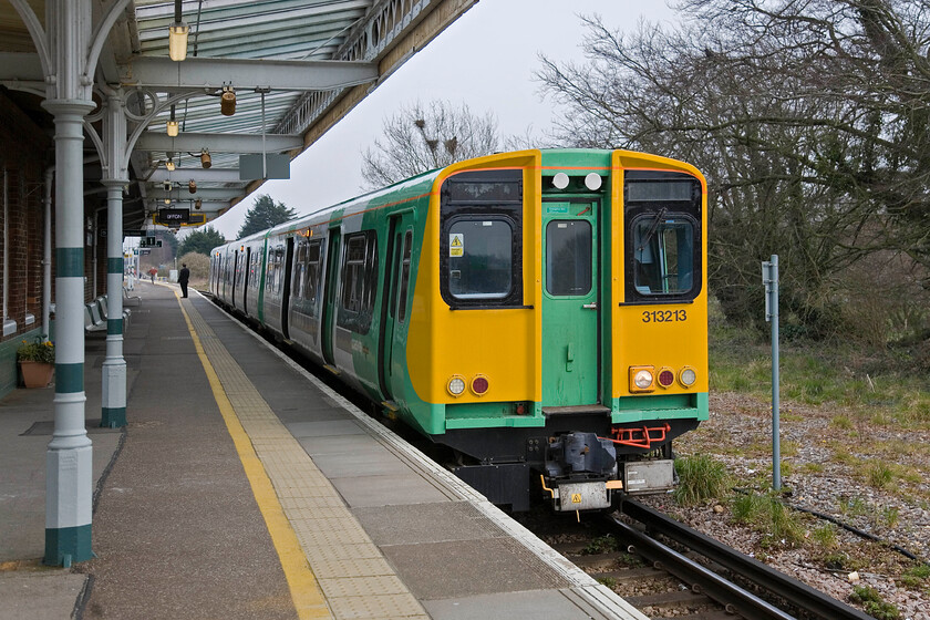 313213, SN 16.24 Barnham-Bognor Regis, Barnham station 
 Being on 'shuttle duties' 313213 was seen and photographed a little earlier at Bognor. The veteran unit is now seen at Barnham waiting to leave with the 16.24 service back to Bognor. Barnham station had a real old-style feel about it with busy mainlines as well as a traditional branch line running a short distance to the coast. The only other one that I can think of that feels like this is just along the coast at Brockenhurst. 
 Keywords: 313213 16.24 Barnham-Bognor Regis Barnham station Southern