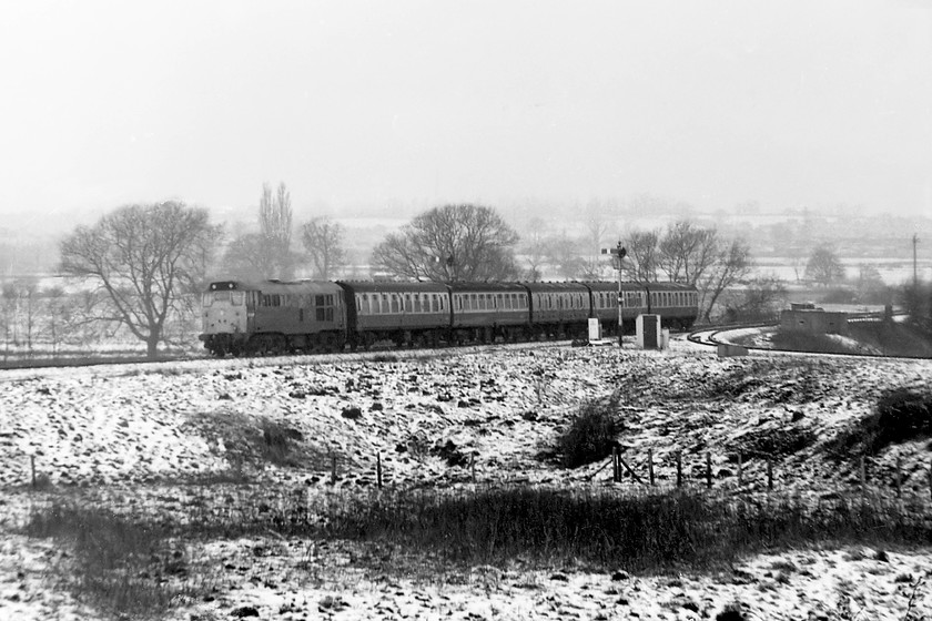 31420, 09.20 Bristol Temple Meads-Weymouth, from Bradford Junction signal box 
 Not a great quality picture but an interesting one nonetheless. After some late winter overnight snowfall and using my 135mm telephoto lens, 31420 is seen leading the 09.20 Bristol Temple Meads to Weymouth past Bradford North Junction. The picture is taken from the window of Bradford Junction signal box with access permitted by the signalman Mervin Holbrook who lived a few doors away from my family in the village of Winsley. 
 Keywords: 31420 09.20 Bristol Temple Meads-Weymouth Bradford Junction signal box