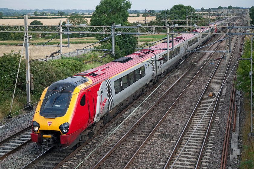 221143 & 221108, VT 05.38 Lancaster-London Euston (1A04, 11L), Hungate End SP784465 
 'Auguste Picard' and 'Sir Ernest Shackleton' speed through north Buckinghamshire! The 05.38 Lancaster to London Euston passes Hungate End just south of Hanslope Junction formed of Virgin's 221143 and 221108. 
 Keywords: 221143 221108 1A04 Hungate End SP784465