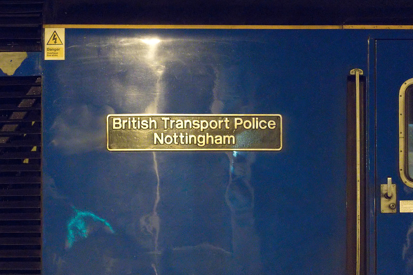 Nameplate, 43467, EM 18.37 Corby-London St. Pancras (1P41, 2L), Wellingborough station 
 Ex Grand Central HST power car 43467 carries two names. On this side, it is 'British Transport Police Nottingham' and on the other side it carries a red plate, 'Nottinghamshire Fire and Rescue'. The power car was named in a short ceremony at Nottingham station on 12.02.18 after the two key teams that dealt with the fire at the station a month earlier on 12.01.18. This naming ceremony also marked the reveal of East Midlands Trains' new livery as applied to the former Grand Central buffer beam fitted power cars. The train is seen pausing at Wellingborough on a chilly November night at the rear of the 18.37 Corby to St. Pancras. 
 Keywords: Nameplate 43467 18.37 Corby-London St. Pancras 1P41 Wellingborough station HST