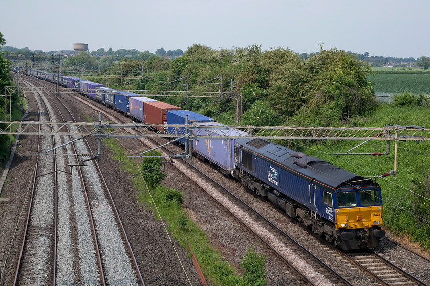 66425, 13.09 Daventry-Purfleet FLT (4L48), Victoria Bridge 
 A beautiful late spring day sees 66425 lead the heavily laden 13.09 Daventry (DIRFT) to Purfleet Freightliner. The train is seen passing Victoria Bridge between Northampton and Milton Keynes. This is regular Sunday freight working that I been out to photograph on a number of occasions. 
 Keywords: 66425 13.09 Daventry DIRFT -Purfleet FLT Freightliner 4L48 Victoria Bridge