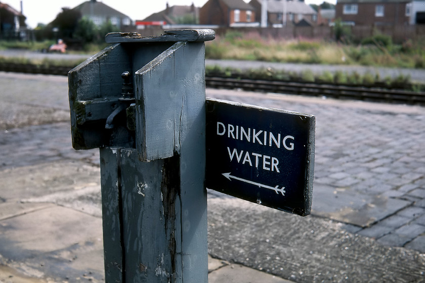 Enamel & tap, Sleaford station 
 I am not at all sure if I would want to drink from the tap seen here on Spalding station? However, my attention was drawn due to its enamel sign. I am not sure if this was of LNER or of later British Railways (Eastern) origin; although I suspect the latter as I don't think that the font is quite correct for the former. Either way, the whole thing is a very quaint piece of station infrastructure dating from a past railway era. 
 Keywords: Enamel & tap, Sleaford station