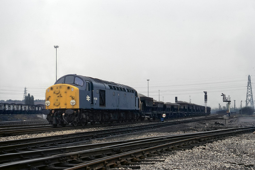 40003, down PW train, Toton Yard 
 40003 arrives at Toton yard from the south. It is seen heading a PW train. After briefly pausing, it then continued off north up the Erwash Valley route. Two days later it was noted at Healey Mills. Introduced in September 1958 as D203, 40003 survived for another three years after this picture was taken when it donated a bogie to 40057. 
 Keywords: 40003 down PW train Toton Yard