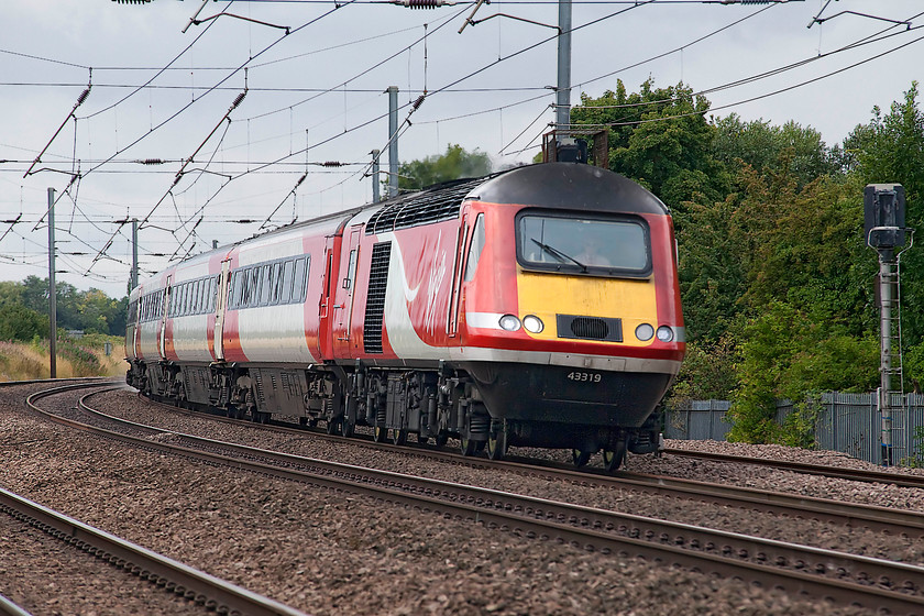 43319, GR 10.00 London Kings Cross-Aberdeen (1S11, 3E), Offord DArcy TL213655 
 43319 takes the reverse curve as it approaches Offord DArcy working the 10.00 King's Cross to Aberdeen 1S11 service. 43319 was delivered as 43119 as part of the final Eastern Region set 254032 in the summer of 1979. The picture is taken from the security of a foot crossing . 
 Keywords: 43319 1S11 Offord DArcy TL213655