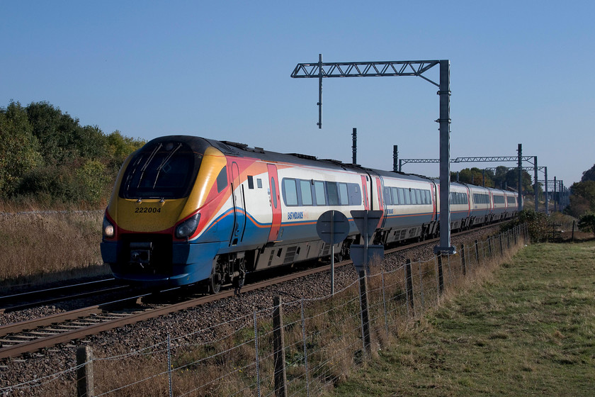 222004, EM 13.02 London St. Pancras-Sheffield (1F35, 6L), Irchester SP927667 
 222004 'Children's Hospital Sheffield' heads north past Irchester with the 13.02 St. Pancras to Sheffield 1F36 working. It is just about bearable to take picture with the electrification masts in view, but a lot more will be added soon making this spot (and most others) very tricky to get decent pictures at. 
 Keywords: 222004 13.02 London St. Pancras-Sheffield 1F35 Irchester SP927667