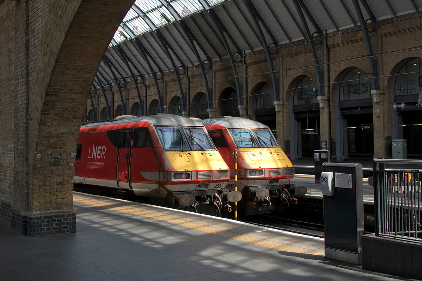 82203, GR 12.33 London King`s Cross-Leeds (1D14, 6L) & 82227, GR 12.30 London King`s Cross-Newcastle (1N17, 1L), London King`s Cross station 
 A pair of class 82 DVTs rest in the sunshine at King's Cross station. To the left, 82203 will be at the rear of the 12.33 to Leeds and to the right, 82227 the 12.30 to Newcastle. In the final months of their working lives on the ECML these DVTs and their paired class 91s have entered a reliable phase after many problems that resulting in failures. 
 Keywords: 82203 12.33 London King`s Cross-Leeds 1D14 82227 12.30 London King`s Cross-Newcastle 1N17 London King`s Cross station