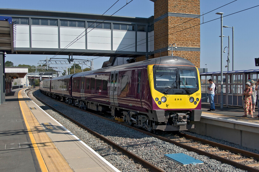 360107 EM 10.40 Corby-London St. Pancras (1Y22, 1L), Wellingborough station 
 The squadron take-over by the fleet of former Greater Anglia Desiros on the Corby to London St. Pancras route has been a great success with the units settling into their new route well ad proving to be reliable as would be expected with this family fleet of units. However, on this particular morning, something has gone awry as my wife and her friend were delayed by half an hour as their train south was cancelled. They had to board this one, the 10.40 Corby to London service worked by 360107. They are just out of sight at Wellingborough station as the Desiro coasts in. 
 Keywords: 360107 10.40 Corby-London St. Pancras 1Y22 Wellingborough station EMR East MIdlands Railway Desiro