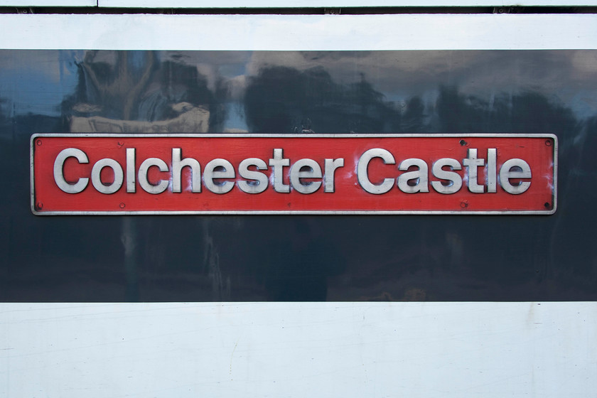 Nameplate, 90015, 15.00 Norwich-London Liverpool Street (1P47, RT), Norwich station 
 The nameplate of 90015 'Colchester Castle' stands at Norwich station at the head of the 14.00 to London Liverpool Street. I took this 1P47 working as far as its first stop, Diss. 
 Keywords: Nameplate 90015 14.00 Norwich-London Liverpool Street 1P47 Norwich station