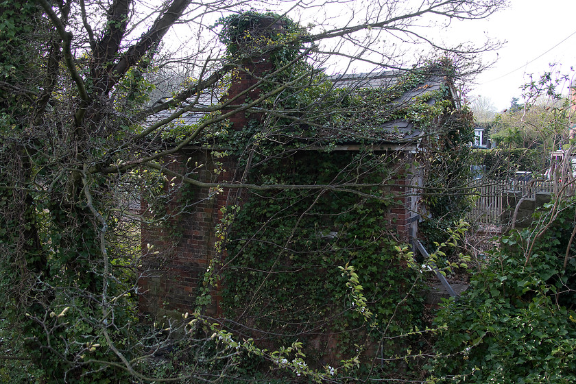 Sleights signal box (Closed) (NE, c.1876) 
 Behind the veil of ivy is Sleights' ex North Eastern signal box! From the rear it is virtually unrecognisable but appears to be largely intact. 
 Keywords: Sleights signal box