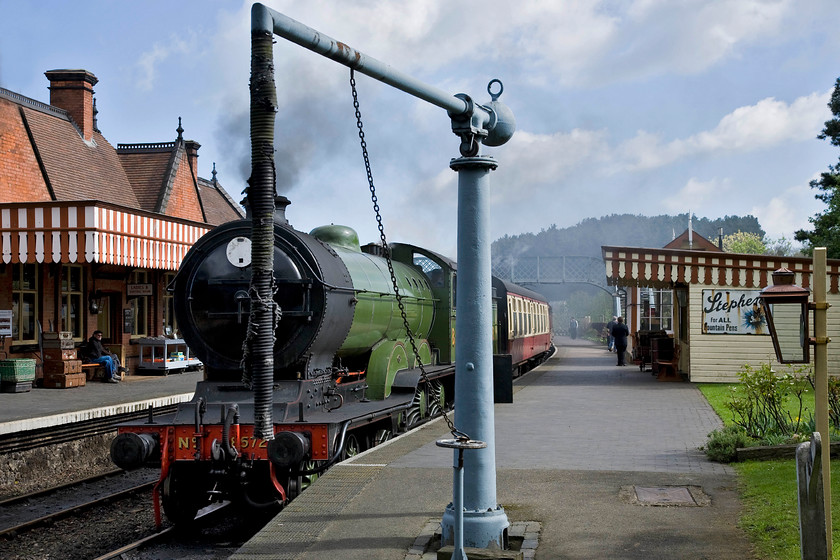 8572, 11.15 Sheringham-Holt, Weybourne station 
 LNER B12 8572 rests at Weybourne station having just arrived with the 11.15 Sheringham to Holt North Norfolk Railway service on a chilly but bright April morning. The locomotive is partially obscured by the period water crane. I am not sure if this is serviceable or just kept for show? 
 Keywords: 8572 11.15 Sheringham-Holt Weybourne station Poppy Line NNR North Norfolk Railway B12 4-6-0