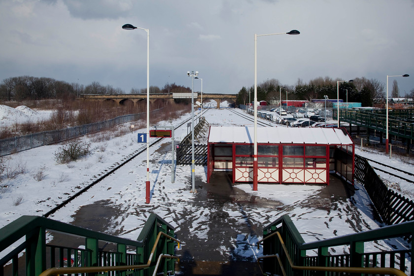 Normanton station 
 Taken from the newly installed footbridge, the view shows the remains of the once very grand Normanton Station. It was opened by the North Midland Railway in 1840. It grew to become a very important and grand station that boasted a Station Hotel once used by Queen Victoria. Post Beeching, many of the lines that came together near Normanton closed and its importance wained. With the further industrial decline of the '80s the station building fell into complete disrepair and the whole site ended up in a shocking state. Thankfully, some investment has taken place, passenger numbers and services are on the up and it's going through a mini-renaissance; it's still a bit of a desolate spot though! 
 Keywords: Normanton station