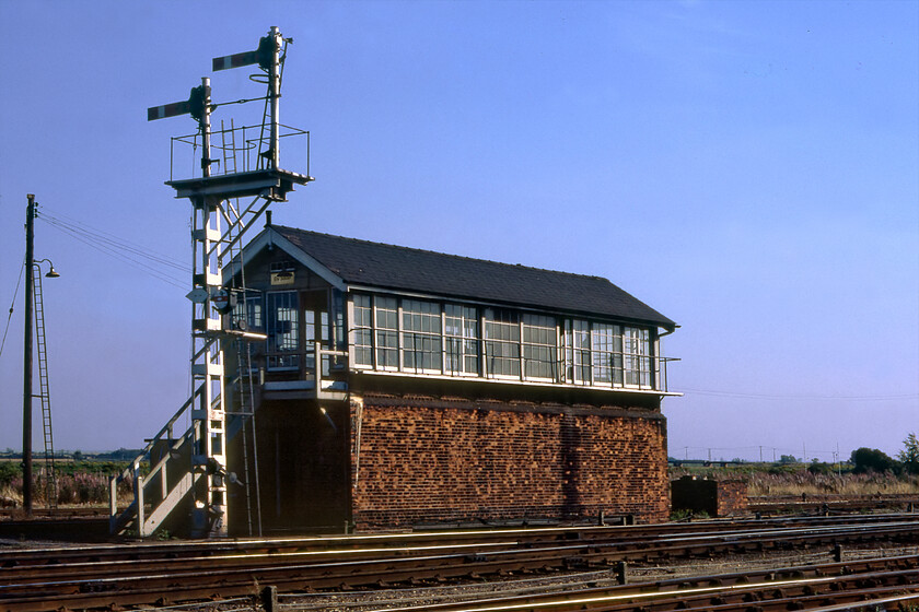 Ely South signal box (LNER, c.1920) 
 Ely South signal box was often referred to as Station South box due to its location on the end of the platform ramp. It was an LNER box dating from sometime around 1920 but I would appreciate some more accurate information on that if possible. The tall cast signal post carrying a submissive and permissive arm looks superb. To get this photograph (and the rest in this sequence) I suspect that Graham and I were undertaking some sort of trespassing activity that simply would not be possible or tolerated today with the BTP on to one in no time! 
 Keywords: Ely South signal box LNER London and North Eastern Railway