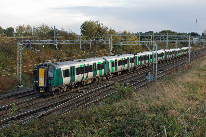 350376, LN 14.05 Birmingham New Street-Liverpool Lime Street (1F46, 6L), Cassey bridge 
 As my drive home took me along the A500 Crewe southern relief road I thought that I would take a dive off it and call in at Cassey bridge just south of Basford Hall. However, on arrival, I consulted my 'phone and found that I had missed a number of recent freight workings. With nothing of interest due for a while, a long drive ahead of me and having just changed the clocks, a rapidly darkening late afternoon I decided to head for home. I managed a record shot of 350376 leading another Desiro on the 1F46 14.05 Birmingham to Liverpool service. 
 Keywords: 350376 14.05 Birmingham New Street-Liverpool Lime Street 1F46 Cassey bridge London Northwestern Desiro