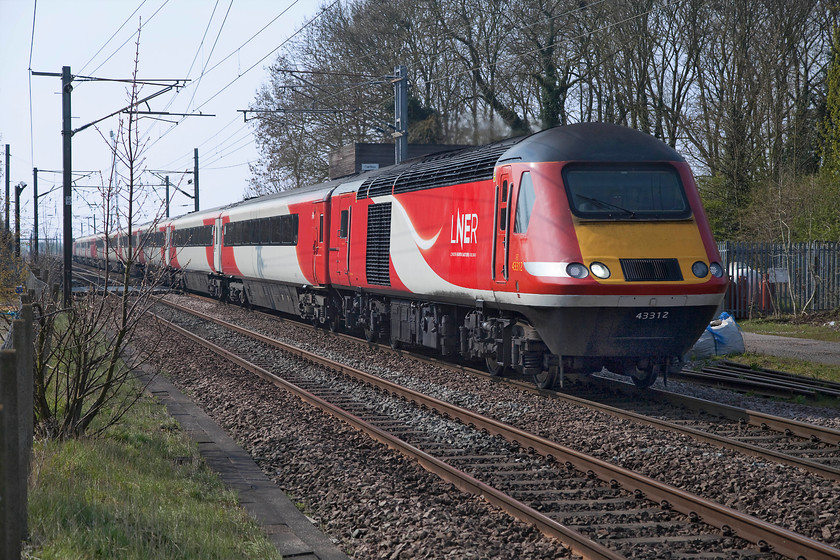 43312, GR 09.06 London King`s Cross-York (1N81, 1L), Great Northern Inn car park, Carlton 
 The 09.06 King's Cross to York passes Carlton between Retford and Newark. HST power car 43312 is leading the train, a semi-fast working in it's final few weeks of operation prior to the Azumas entering service. Ironic that these were exactly the sort of services that the Deltics operated in their twilight months. The picture is taken leaning over the fence of the appropriately named Great Northern Inn car park. 
 Keywords: 43312 09.06 London King`s Cross-York 1N81 Great Northern Inn car park, Carlton