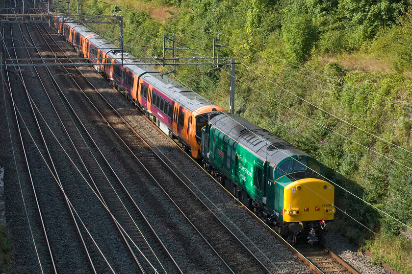 37608, 730035 & 730026, 10.38 Old Dalby-Willesden TMD (5Q74, 3E), Hyde Road bridge 
 Another Class 37 in action on the WCML! This time, it's the turn of Rail Operations Group's 37608 'Andromeda' passing Roade towing 730035 and 730026. Having been undertaking some sort of testing or other the units are returning south as the 5Q74 10.38 Od Dalby to Willesden move. There is a burgeoning market of moving stock around the country be it new ones like this or older ones for scrapping with companies such as ROG attempting to corner that market. 
 Keywords: 37608 730035 730026 10.38 Old Dalby-Willesden TMD 5Q74 Hyde Road bridge Andromeda