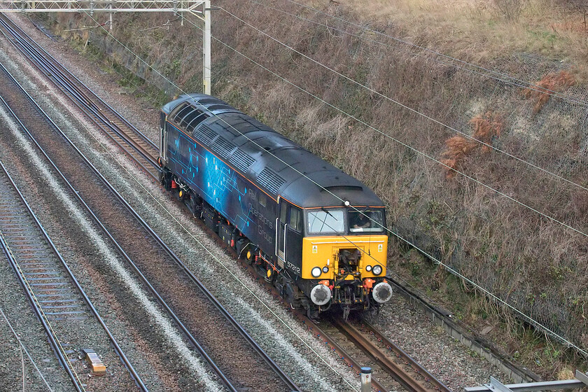 57312, 09.11 Derby RTC-Wembley Yard (0H72, 14E), Hyde Road bridge 
 Rail Operations Group's 57312 heads south through Roade cutting working the 09.11 Derby RTC to Wembley Yard light engine move running as 0H72. I was intrigued as to what this veteran of the network would lead back northwards half expecting it to be one of Orion Logistics unit drags. However, the northbound service that I had my eye on for the Class 57 was cancelled soon after this photograph was taken.

UPDATE....UPDATE.... The next day 57312 towed former TfL Rail EMUs 315854 and 315844 for scrapping from Ilford Depot to Newport Docks (Sims). They were pictured making their final journey along the GWML with the Class 57 upfront by Martin Loader (aka Hondawanderer), see..... http://www.hondawanderer.com/57312_Challow_2022.htm 
 Keywords: 57312 09.11 Derby RTC-Wembley Yard 0H72 Hyde Road bridge Rail Operations Group ROG