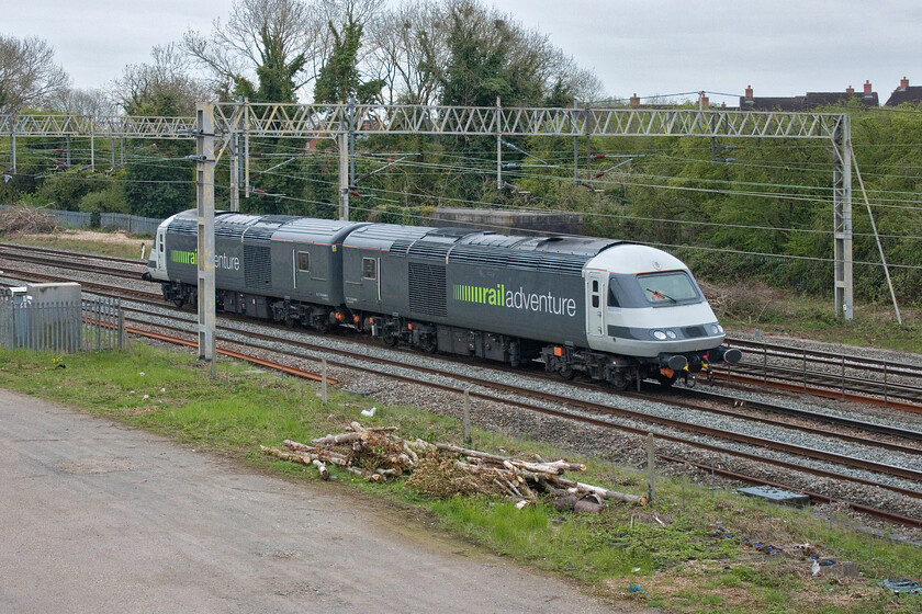 43480 & 43486, 09.49 Wembley Yard-Rugby (0Z44, 1E), site of Roade station 
 Railadventures (sic) 09.49 Wembley Yard to Rugby out-and-back run is seen passing Roade on the down slow line. Former Grand Central buffer fitted 43480 and 43486 look very smart in their livery and I hope that they get more work moving various stock around the network as I saw them doing back in January at the same spot as this, see. https://www.ontheupfast.com/p/21936chg/C385503690/x3-steam-quadruple-hst-freight-sunshine Whoever would have thought than when I saw my first HST back at Bath Spa in 1976 that I would be seeing them forty-five years later in this very different role! 
 Keywords: 43480 43486 09.49 Wembley Yard-Rugby 0Z44 site of Roade station railadventure HST Class 43