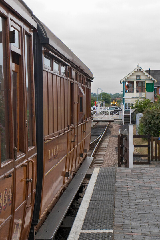 6843, 09.45 Sheringham-Holt & 156417, 08.21 Norwich-Sheringham, Sheringham station 
 Old greets new at Sheringham! In the background GA's 08.21 Norwich to Sheringham (BR) service is just approaching the tiny station worked by 156417. Meanwhile, the 09.45 NNR service to Holt is about to leave formed of their superbly restored quad art set. At the rear of the train is an LNER 4-Wheel Pigeon Van 6843 dating from 1928 now used for the conveyance of bikes, buggies and the like rather than cooing pigeons! 
 Keywords: LNER 4-Wheel Pigeon Van BYP6843 6843, 09.45 Sheringham-Holt 156417 08.21 Norwich-Sheringham Sheringham station