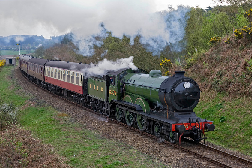 8572, 09.45 Sheringham-Holt, Kelling bank 
 Attracting attention from a member of the train crew I photograph the 09.45 Sheringham to Holt Poppy Line train as it ascends Kelling bank. He is standing on the footplate of ex LNER B12 8572 that is an entirely appropriate locomotive to be found in this part of the UK being based for much of its life at Norwich. And so to the end of another user holiday in Norfolk. Time to finish the packing and head for home. 
 Keywords: 8572 09.45 Sheringham-Holt Kelling bank Poppy Line NNR North Norfolk Railway LNER B12 4-6-0