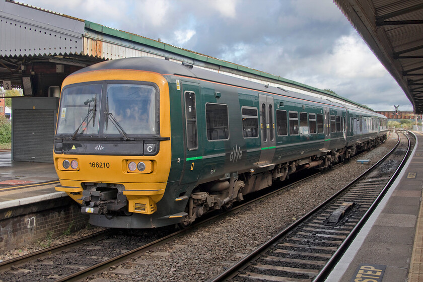 166210, GW 11.11 Westbury-Southampton Central (2O05, 2L), Westbury station 
 GWR's 166210 stands at Westbury station. It will soon work the 11.11 service to Southampton Central a journey that will take in some delightful countryside travelling through south Wiltshire and Hampshire taking in the city of Salisbury on its way. 
 Keywords: 166210 11.11 Westbury-Southampton Central 2O05 Westbury station Turbo GWR