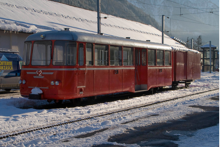 62, stabled, Chamonix Montenvers Mer De Glace station 
 A close-up shot of one of the Mer De Glace mountain railway's coaches complete with a four-wheeled trailer that takes passengers up and down the 3.2-mile rack and pinion railway to the Mer De Glace high station at Monenvers. This is a very popular tourist attraction for visitors to the area but one we did not enjoy as we were too busy enjoying the skiing! 
 Keywords: 62 Chamonix Montenvers Mer De Glace station